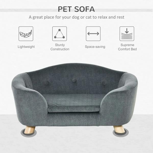 Grey pet sofa bed with curved arms, tufted backrest, plush seat, and wooden support legs
