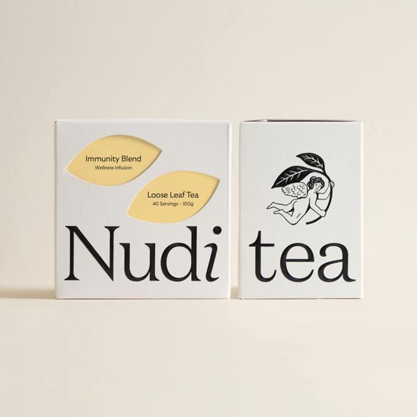Nuditea immunity blend luxury tea box featuring a warm yellow leaf design, elegant finish.