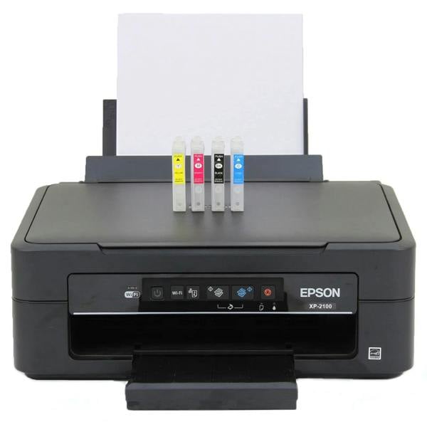 Epson XP-2100 printer in black with four ink cartridges in cyan, magenta, yellow, and black, ready for printing on white paper