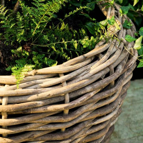 Close up of the top rim of the handwoven rattan planter showing the organic texture.