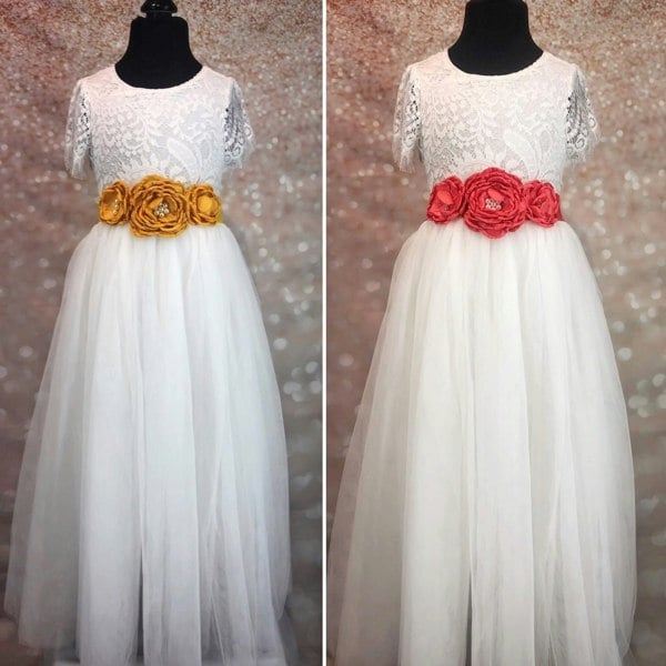 Orange and red sashes on white dresses