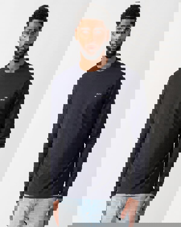 model wearing a BOSS Green Tee Mens Stretch-Cotton T-Shirt with Contrast Logo in Dark Blue