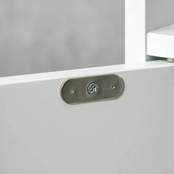 Metal mounting bracket on a white cabinet panel with visible screws