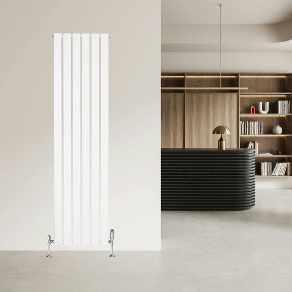 Sleek white flat single column radiator with valves, measuring 1600mm x 420mm, set against a modern interior backdrop
