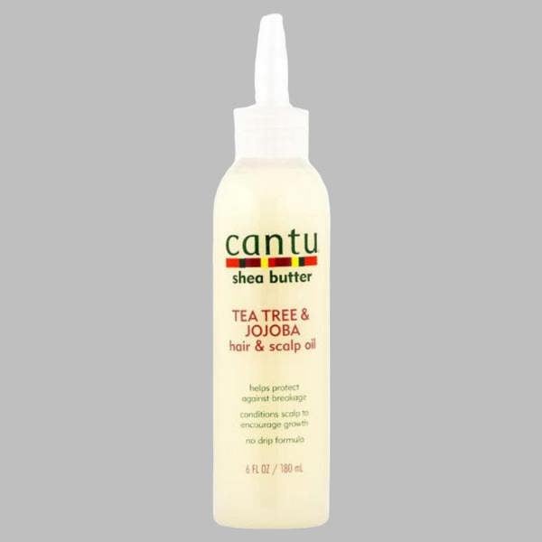 Cantu Shea Butter Tea Tree & Jojoba Oil 180ml to soothe dry scalp and moisturize hair.