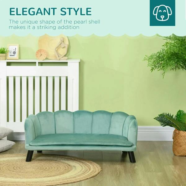 Green dog sofa bed with smooth tufted back, low base, and short black legs