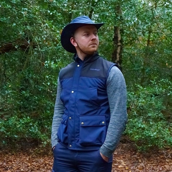 man wearing a wombat navy soft shell outdoor gilet