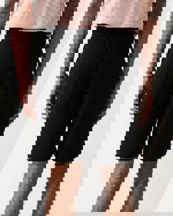 Back shot of a model wearing Belstaff Mens Sweatshorts in Black