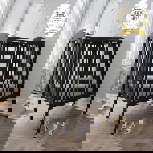 award badge - best baby cot - waffi mini space saver cot with drop side