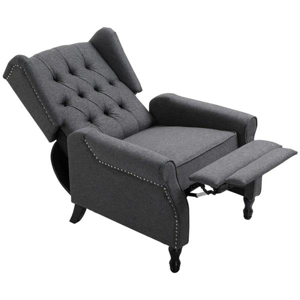 Dark grey recliner armchair with tufted back, nail trim edges, and pull-out footrest