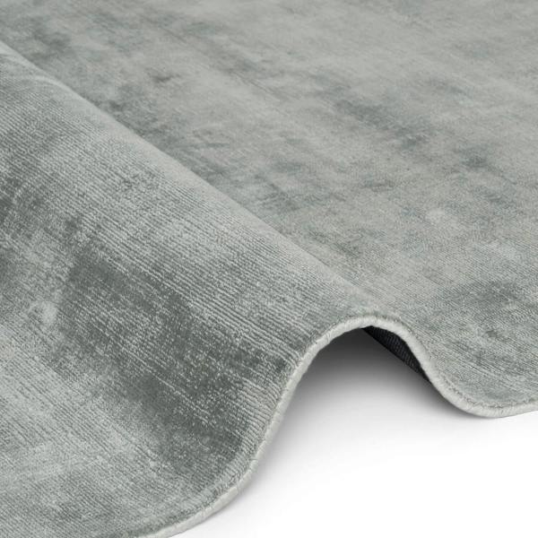 Close-up of a gray textured rug on a white background