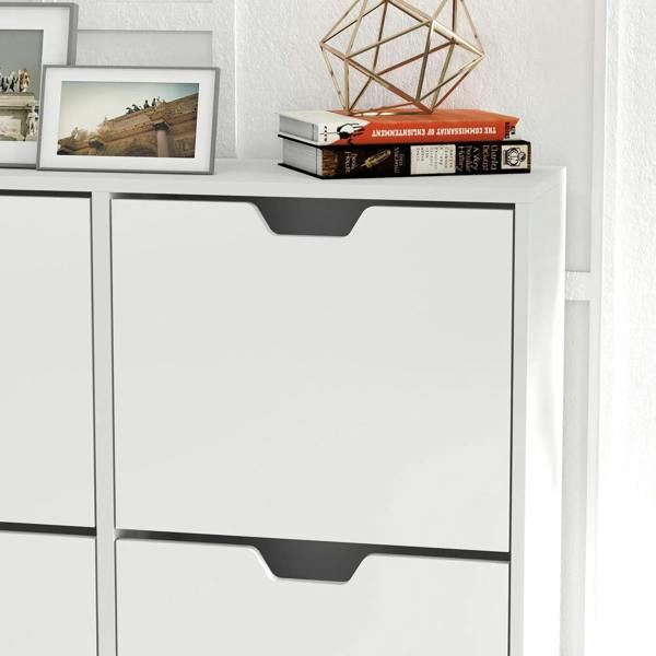 White shoe cabinet close-up of flip drawer front with dark handle cutout