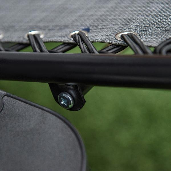 Grey mesh fabric edge secured to black chair frame with bolts