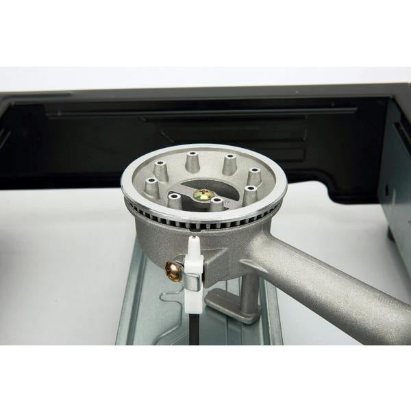 Close-up of a gas stove burner and automatic piezo ignition
