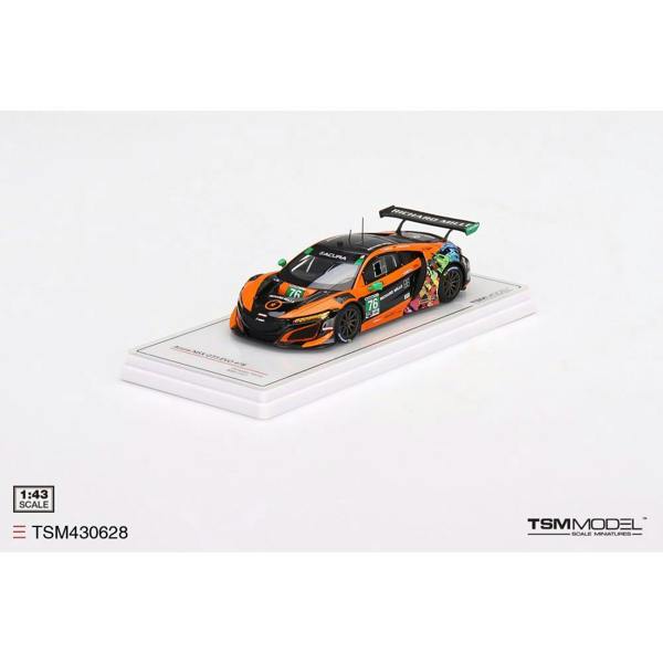 a toy car on a white surface