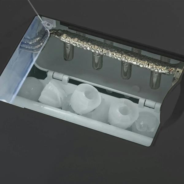 Open ice maker bin with molded ice cubes inside, ready for dispensing