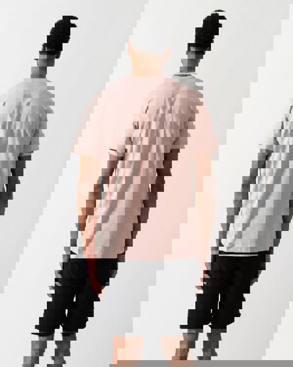 Back shot of a Model wearing a Belstaff Short Sleeved Mens Logo Patch T-Shirt  in Dusk Pink