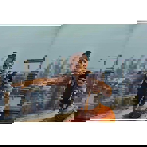 Woman exercising with an adidas 4kg kettlebell