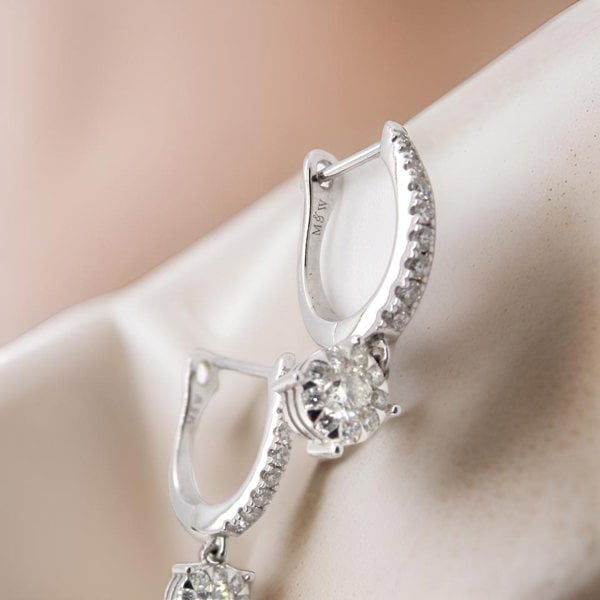 A pair of diamond hoop and drop earrings