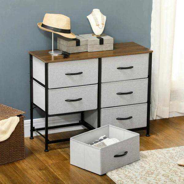 Grey fabric drawer dresser with wooden top, black steel frame, and open storage bin