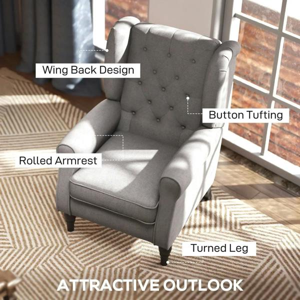 Light grey wingback armchair with button tufting, rolled arms, and turned legs