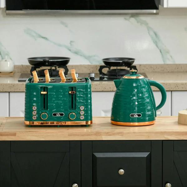 Green toaster and kettle on a wooden surface with black accents and cord base.