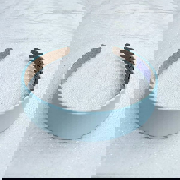 Light blue hairband, smooth satin finish, soft pastel shade, padded structure, minimalist design, elegant everyday accessory
