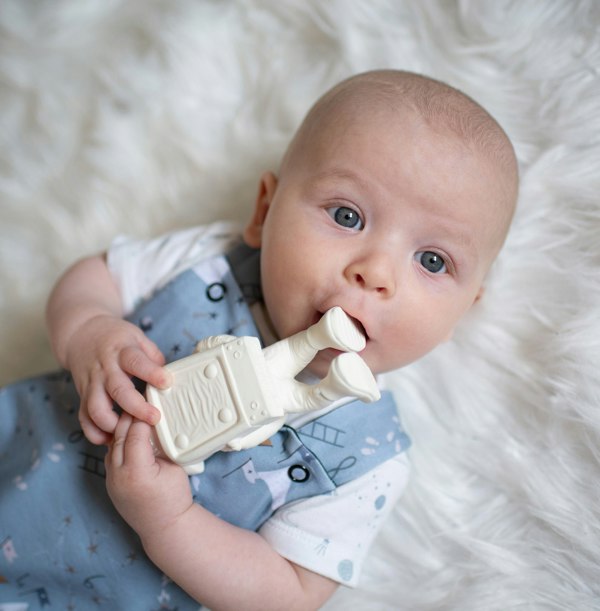 Baby Theo teething on AstroGNAW's lunar boot 