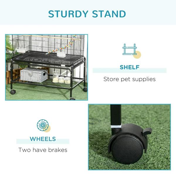 Black bird cage stand with shelf and four caster wheels, two with brakes