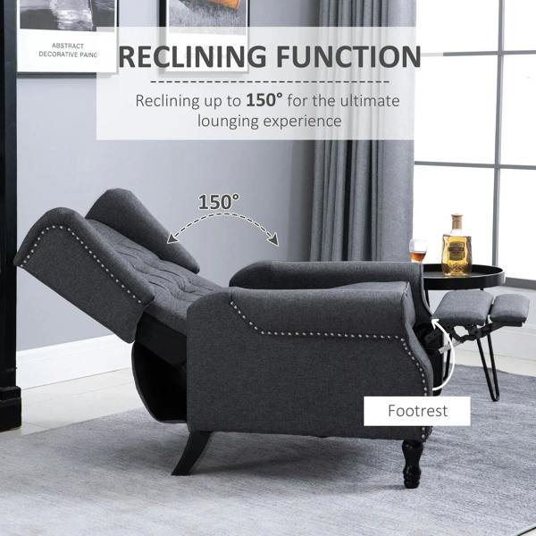 Dark grey recliner armchair reclined with tufted back and matching footrest