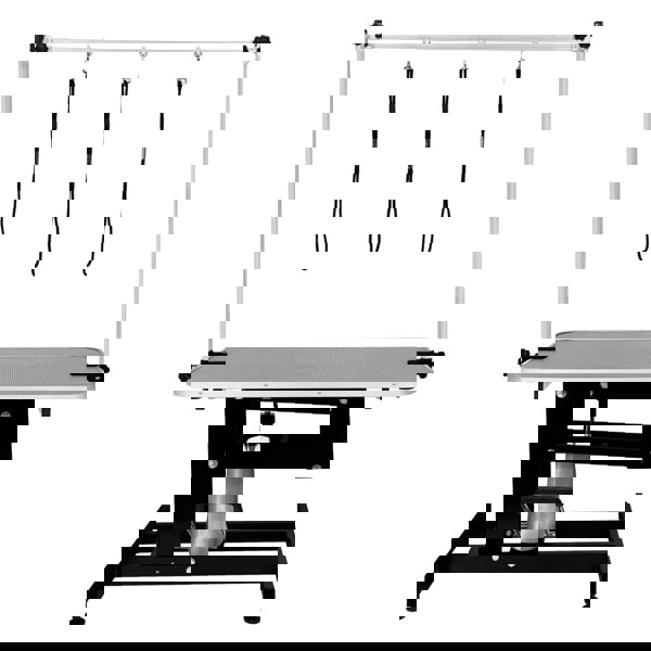 Black hydraulic grooming table with a grey textured top, adjustable height, and three overhead grooming loops for pet safety