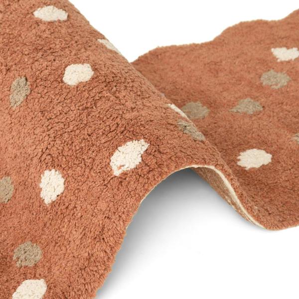 Brown fabric with beige polka dots on a white background
