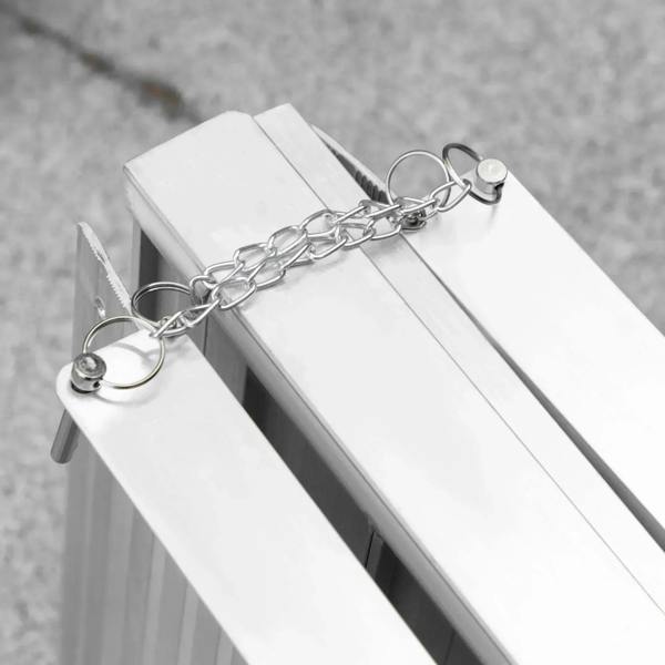 Silver aluminum folding wheelchair ramp with attached security chain and ring handles