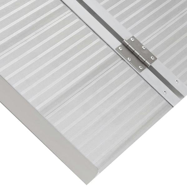 Close-up of aluminum ramp non-slip tread and folded seam with metal hinge hardware