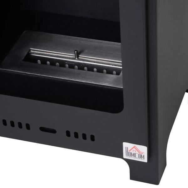 Black ethanol fireplace burner tray and fuel channel in open front, close-up