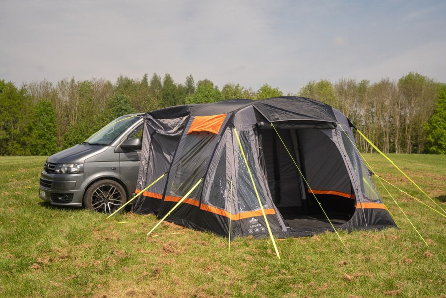 The open front door & fly mesh of a Loopo Breeze® v2 Inflatable Campervan Awning by OLPRO, it is attached to a volkswagen t5 imageset:Charcoal