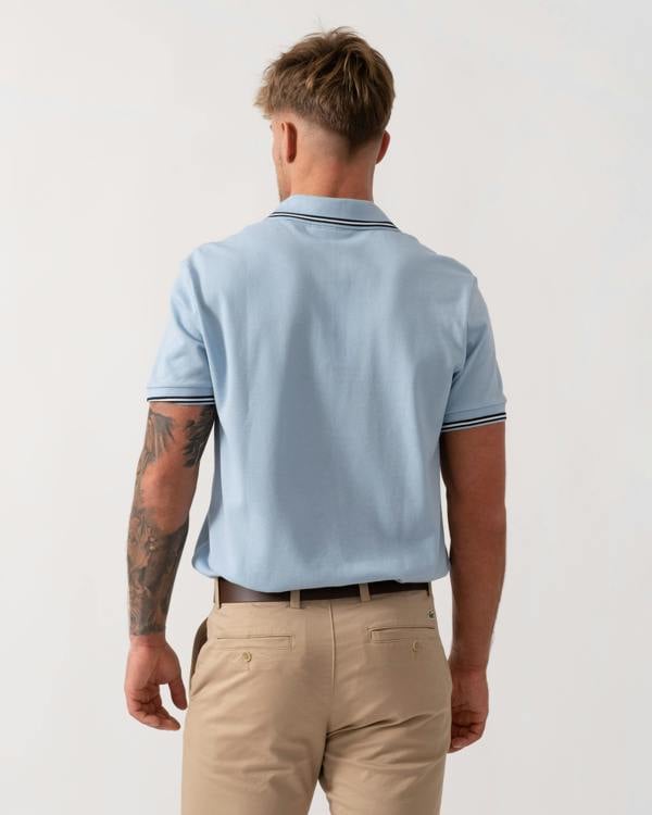 Model wearing Lacoste Contrast Collar Pique Mens Regular Fit Polo Shirt in Chambray - Back