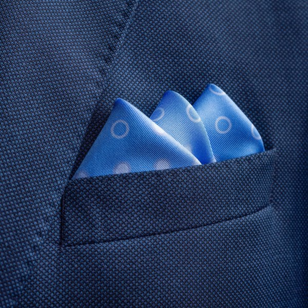 'Luna' polka dot silk pocket square in mid blue by Otway & Orford folded in top pocket