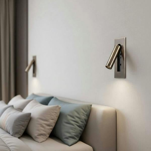 brushed copper recessed bedroom reading light with 2 lights mounted either side of a bed on the wall above the bed 