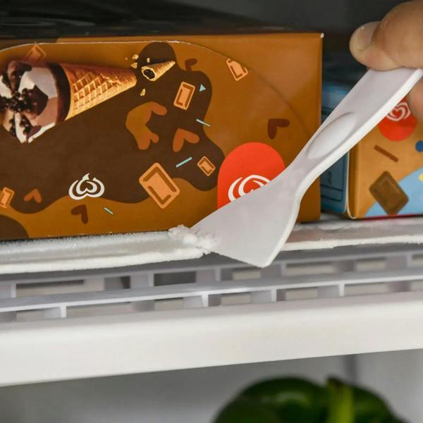 Frosted chiller/freezer shelf with a carton-style food container inside the compartment