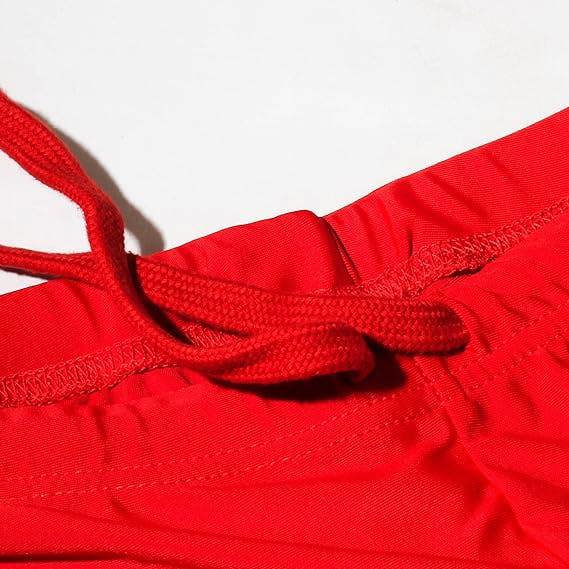 Close-up of red Optimum Multi-X shorts waistband with drawstring, on white - Optimum