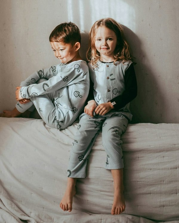 Girl wearing unisex organic cotton kids dungarees