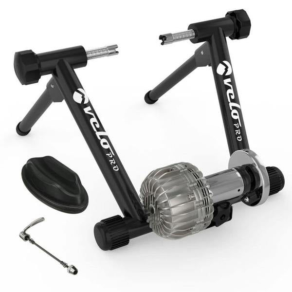 Black Velo Pro Fluid Turbo indoor bike trainer with a sleek black frame, silver resistance unit, and adjustable feet for stability