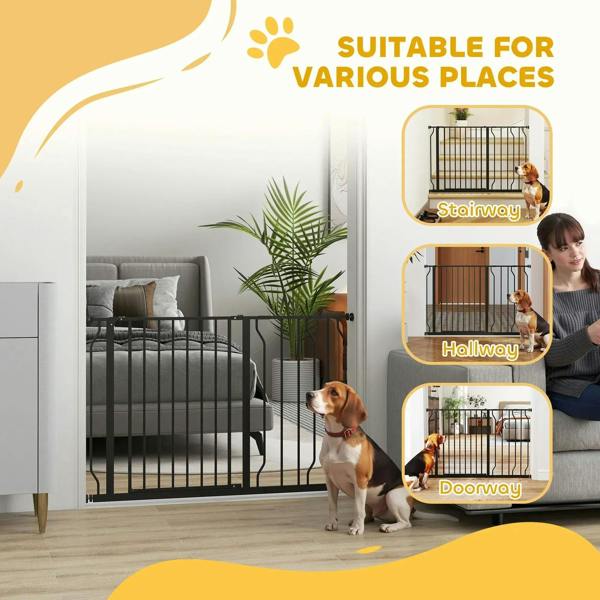 Black pet safety gate set up in a home entryway, with a dog behind the bars