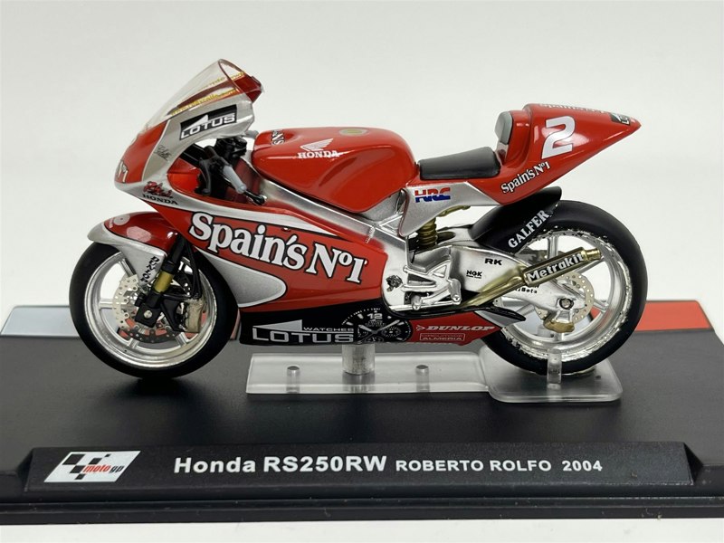 a red and silver motorcycle on a stand