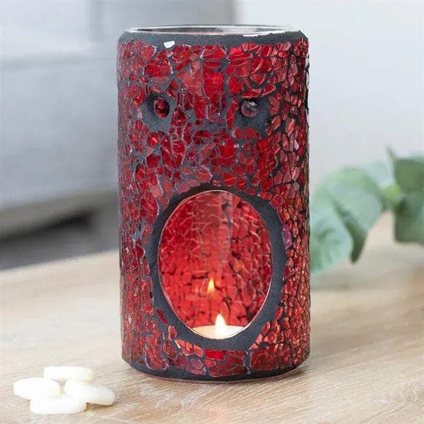 Red crackle glass oil/wax warmer with lit candle flame in round window