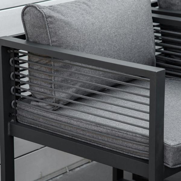 Grey cushioned garden chair with slatted back and armrest, close-up