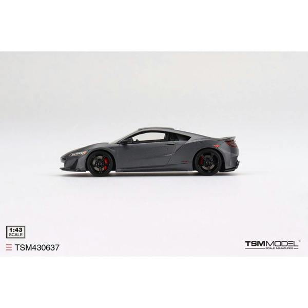a grey sports car on a white background