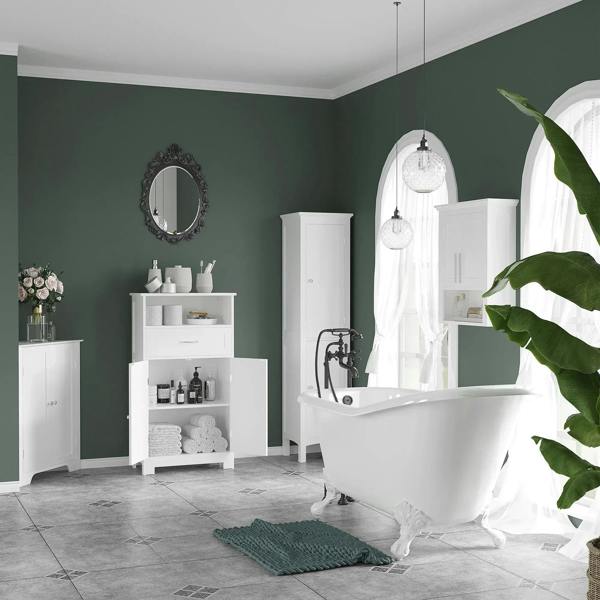 White bathroom storage cabinet with double doors in a bathroom setting