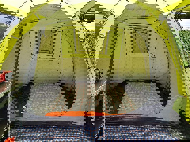 The inside bedroom pod of the Abberley XL 4 Berth Tent by OLPRO with a sleeping bag inside of it.